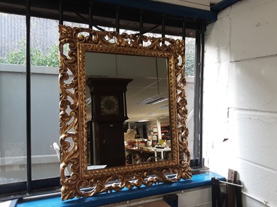 Lot 1071 - Florentine style pierced gilt wall mirror, together with a 19th century gilt oval wall mirror and a mahogany oval wall mirror