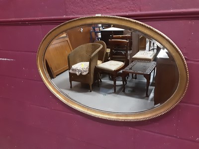 Lot 857 - Oval bevelled wall mirror in gilt frame with beaded decoration, 98cm x 65cm