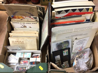 Lot 409 - Two boxes containing cigarette cards, stamps and art books