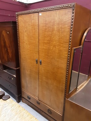 Lot 863 - Good quality Art Deco bedroom suite comprising pair of double wardrobes, each with single drawer below, dressing table with raised triple bevelled mirror back, pair of bedside cabinets and a single...