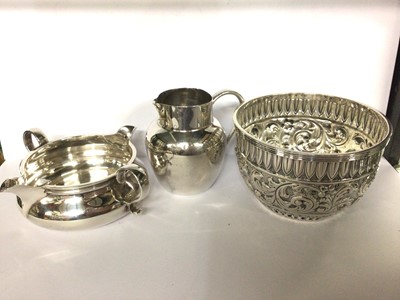 Lot 678 - Victorian embossed silver bowl and two silver cream jugs (3)