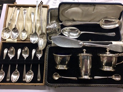 Lot 680 - Three piece silver cruet set in case, set six silver coffee spoons in case, other silver flatware and a plated ladle