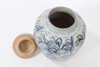 Lot 167 - 17th / 18th century Chinese blue and white jar and cover with floral decoration and another later 19th century Chinese provincial jar (2)
