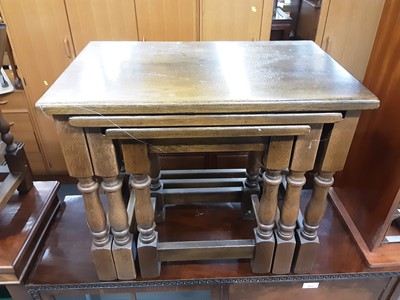 Lot 878 - Oak nest of three tables, small oak drop flap occasional table and a wine rack (3)