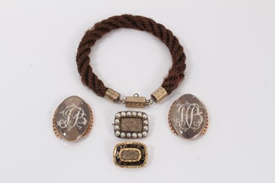 Lot 693 - Collection of Georgian mourning jewellery, including two brooches, two clasps and a bracelet