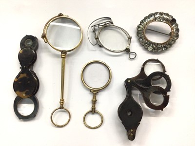 Lot 684 - Two 19th century tortoiseshell magnifying glasses, together with a further magnifying glass, lorgnettes and pince-nez, along with a paste brooch