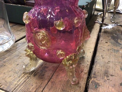 Lot 26 - Pair of Venetian/Murano cranberry glass vases with gold aventurine lions mask prunts, together with a glass bell shape decanter