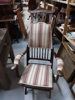 Lot 901 - Early 20th century folding elbow chair with upholstered seat, back and arms, with spindle decoration