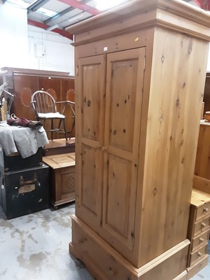 Lot 925 - Contemporary pine wardrobe with two panelled doors and drawer below 211cm high, 99 cm wide