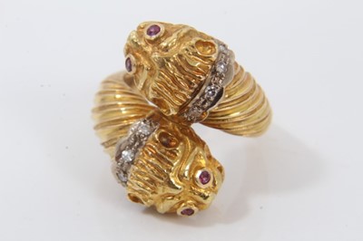 Lot 645 - Unusual gold Lions head cross over ring