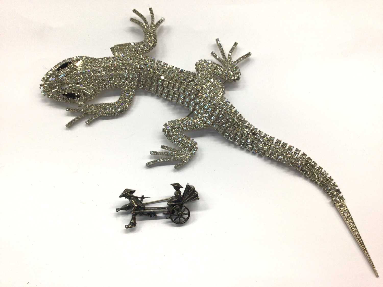 Lot 686 - 1980s Butler & Wilson paste set lizard brooch and silver Rickshaw brooch (2)